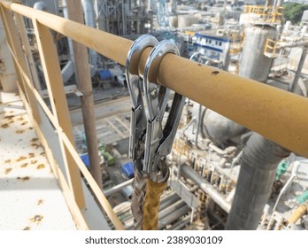 The hook harness must be attached when working at heights in the construction area to make it safer