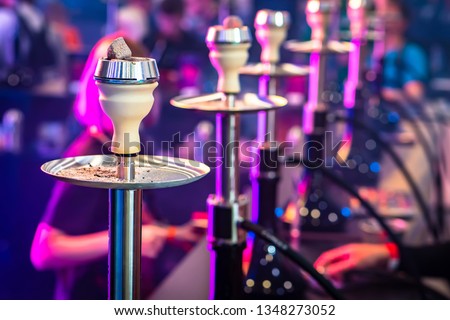 Hookah bar. A lot of hookahs are on the bar.