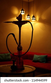 Hookah In The Lounge With Red Sofas