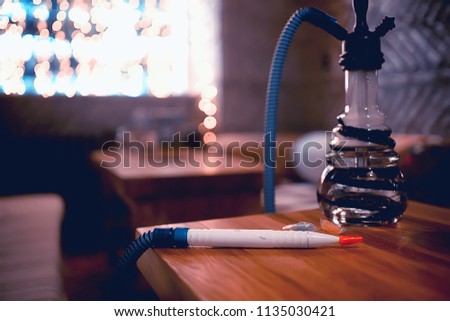 hookah in the restaurant / hookah elements on the background of a blurry interior of the restaurant, a cafe with a bokeh