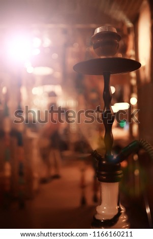 hookah in the restaurant / hookah elements on the background of a blurry interior of the restaurant, a cafe with a bokeh