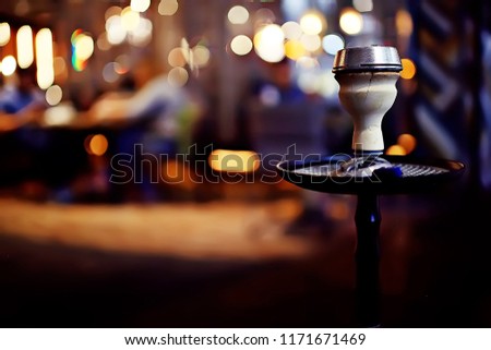 hookah in the restaurant / hookah elements on the background of a blurry interior of the restaurant, a cafe with a bokeh