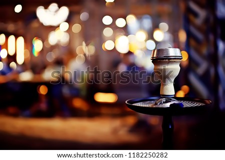 hookah in the restaurant / hookah elements on the background of a blurry interior of the restaurant, a cafe with a bokeh