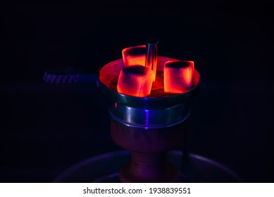 Hookah Or Shisha Head With Hot Coals On Dark Background With Black Light.