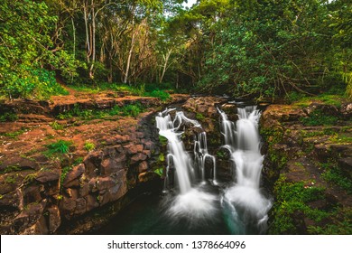 Ho'opi'i Falls, a set of waterfalls and popular hiking location and local swimming hole along  Kapaʻa Stream, located near Kapaʻa town on the east shore of the island of Kauai, Hawaii, United States. 