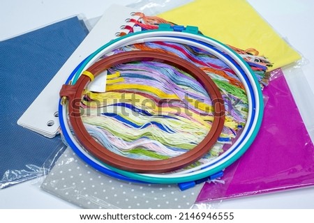 Hoops and frames are tools used to keep fabric taut while working with embroidery or other forms of needlework.