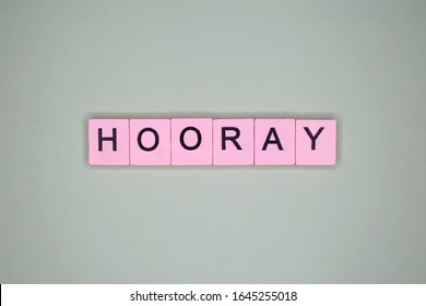 Hooray word wooden cubes on a light background