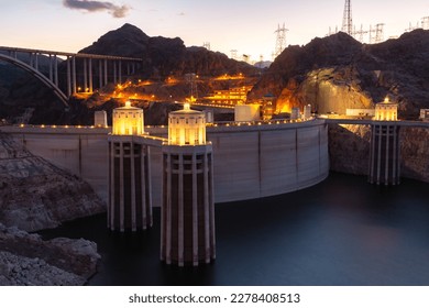 Hoover dam close-up shot. Hoover dam and Lake Mead in Las Vegas area. Large Comstock Intake Towers At Hoover Dam. Hoover Dam in the evening with illuminations without people.