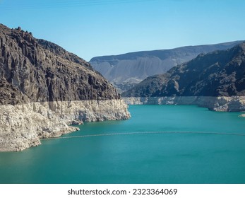 The Hoover Dam looking towards Lake Mead from the Mike O'Callaghan–Pat Tillman Memorial Bridge, Nevada  Arizona state line, USA. Blue turquoise water surrounded by lush dry mountain ranges