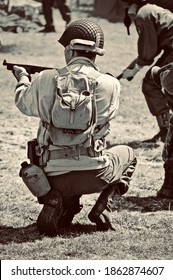 HOP FARM ,KENT,ENGLAND-22nd JULY 2010. WW2 US Soldier Attacks Enemy With His Tommy Gun During Battle Re-enactment.