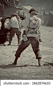 HOP FARM ,KENT,ENGLAND-22nd JULY 2010. WW2 US Soldier Attacks Enemy With His Tommy Gun During Battle Re-enactment.