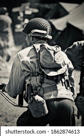 HOP FARM ,KENT,ENGLAND-22nd JULY 2010. WW2 US Soldier Attacks Enemy With His Tommy Gun During Battle Re-enactment.