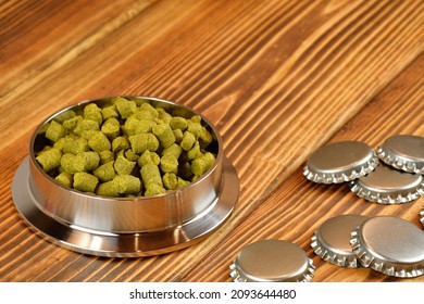 Hop Pellets For Beer Brewing. Home Brewing Ingredient And Beer Bottle Caps.