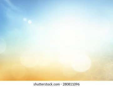 Hope Concept: Abstract Bokeh Sun Light With Blurred Yellow And Blue Color Sky On Beach Background