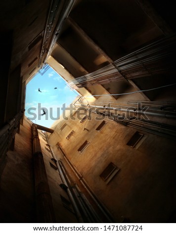 Similar – Schmales Fenster in der Steinmauer mit Blick auf das Pariser Stadtbild