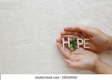 HOPE With Lime Green Ribbon On Hands ,Lyme Disease, , Organ Donation, Mental Health Awareness