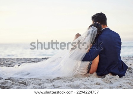 I hope we stay like this forever. Shot of a young couple on the beach on their wedding day.