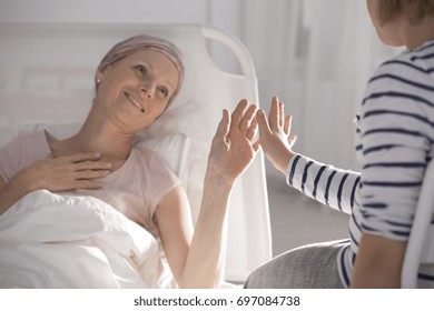 Hopeful Cancer Woman Lying In Hospital  Playing With Daughter 