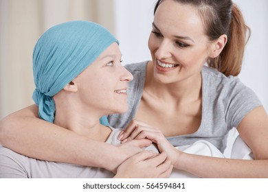 Hopeful Cancer Woman Wearing Headscarf, Talking With Friend