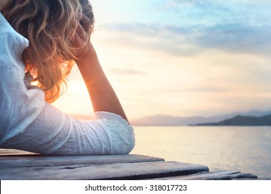 hopeful woman observing the sunset