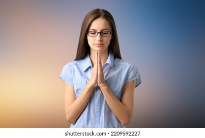 Hopeful Woman In Prayer Pose On Background