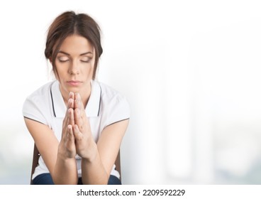 Hopeful Woman In Prayer Pose On Background