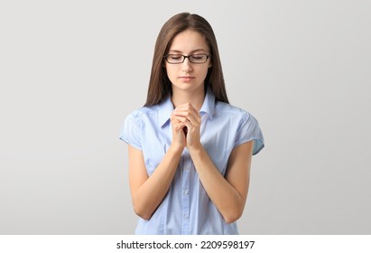 Hopeful Woman In Prayer Pose On Background