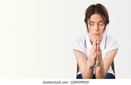 Hopeful Woman In Prayer Pose On Background