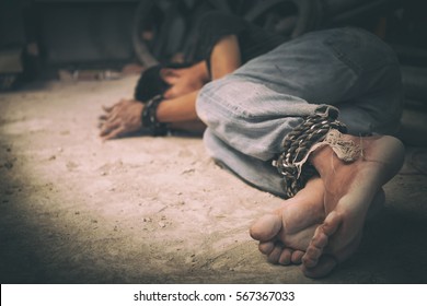 hopeless man hands tied together with rope, human trafficking - Shutterstock ID 567367033