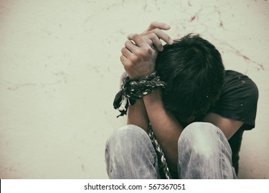 Hopeless Man Hands Tied Together With Rope, Human Trafficking