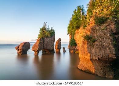 Hopewill Rock at sunrise during high tide, New Brunswick, Canada