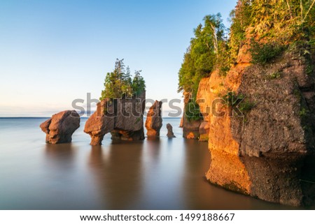 Hopewill Rock at sunrise during high tide, New Brunswick, Canada