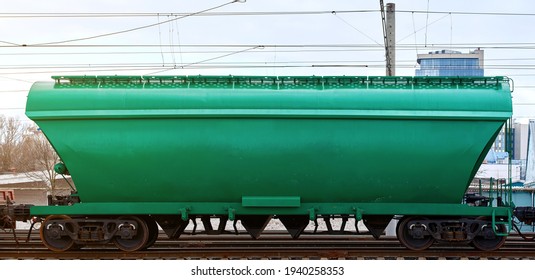 Hopper wagon, freight railroad hopper car.Transportation grain cargo on railway. Railroad grain hopper platform on track. 