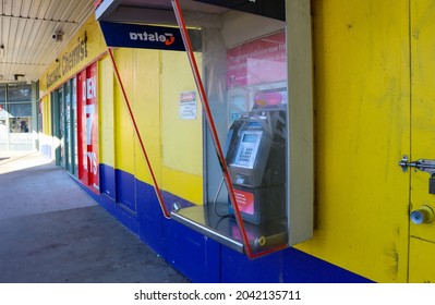 Hoppers Crossing, Vic Australia - Sept 16 2021: Telstra public phone in suburban shopping strip