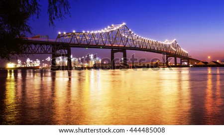 Horace Wilkinson Bridge crosses over the Mississippi River at night in Baton Rouge, Louisiana
