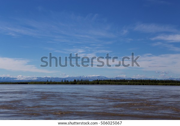 Horizon line between the river and the sky.\
Indigirka River. Yakutia.\
Russia.