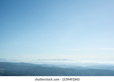 Horizon with Slovakian mountains (Mala Fatra) in the distance. Nature and good visibility. Clear blue sky during sunny weather as very large copy space area. 