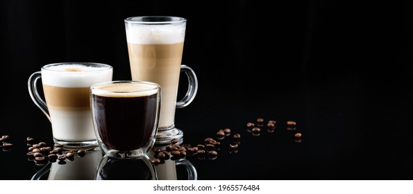 horizontal banner with different types of coffee in glasses on a black mirror background, cappuccino, americano, latte macchiato, coffee beans
