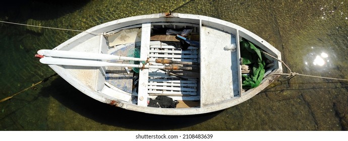 Horizontal Banner Or Header With Empty Fisherman Rowing Boat At The Port - Top View Of Wooden Fishing Boat