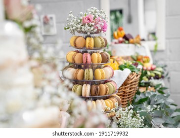 Horizontal Beautiful Macaron Cake Patisserie Multi Tier Stand Full Of Macarons All Flavours Colours Real Wedding With Flowers And Roses Pink Strawberry Yellow Brown Chocolate Cookies Pyramid Tower