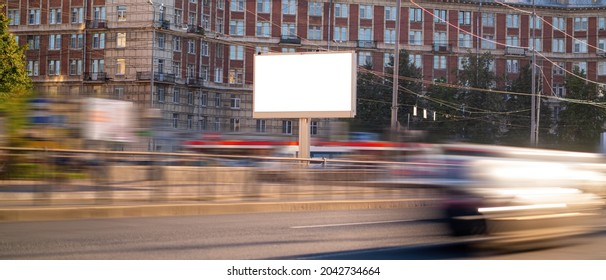 Horizontal Billboard Next To The Road With Blurred Cars, Mockup With Advertising Space.