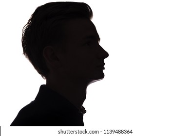 Horizontal Black And White Silhouette Of An Unrecognizable Guy, Young Man Face Profile On A White Isolated Background