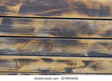 Horizontal burnt and brushed aged wooden planks