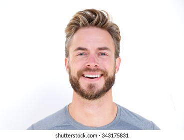 Horizontal close up portrait of a man with beard laughing on isolated whit background