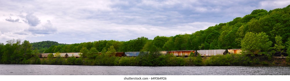 Horizontal Composition Of An Old Freight Train Chugging Along The Country Side By A River.
Great For A Banner Or Heading.