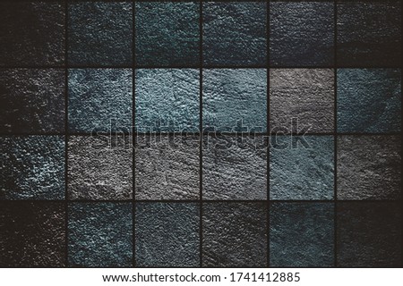 Horizontal grunge background consisting of squares of different textures and shades. Beautiful textured wall background. Blue, turquoise and purple tones. Abstract cube pattern. Color of the year 2020