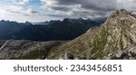 Horizontal high resolution panorama of green luscious details in Norwegian mountains seen from Smaltinden, Luröy, Helgeland, Nordnorge. Green mountains. Hills of norway. Nordic coastline High contrast