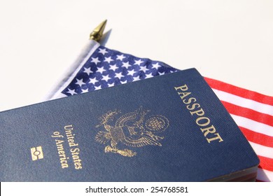 A Horizontal Image Of An American Passport On An American Flag