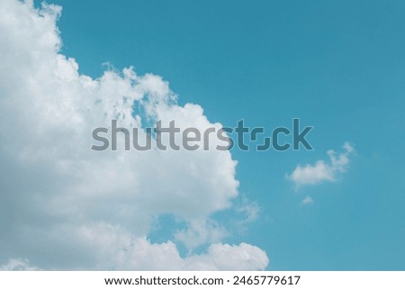 Horizontal image of beautiful celestial landscape with white clouds and blue background