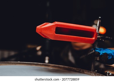 horizontal image of latin percussion set with a plastic cowbell instrument and a snare drum in a music studio, blurred background, music industry concept.